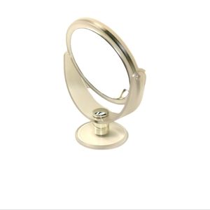 Dual sided magnifying mirror